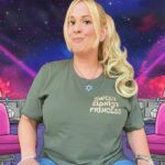 A satirical cartoon-style image featuring Daisy Chain, the "Sweet Zionist Princess," positioned in the center of a cosmic-themed hair salon. She is wearing a green t-shirt with "Sweet Zionist Princess" text and a Star of David necklace. The background shows a space nebula with pink salon chairs and futuristic hair dryers that are firing purple "space lasers" into the atmosphere.
