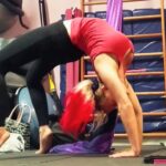 Queen Daisy Chain, the 4'11" pocket pretzel, doing a back bend at the gym.