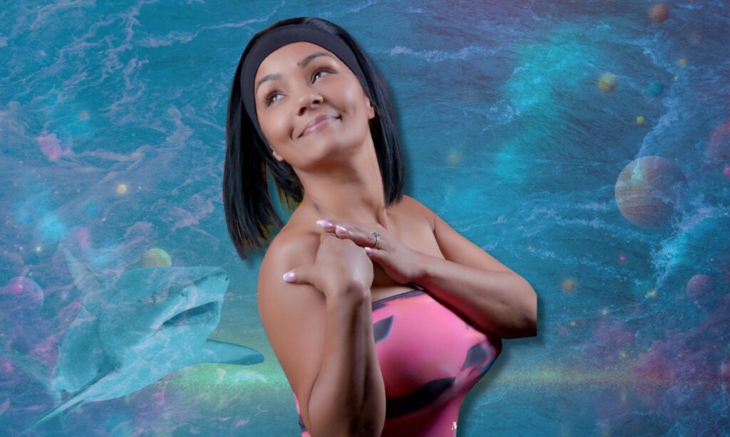 Queen Candy Kane in front of an ocean backgound with a shark.